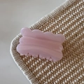 Close-up of pink jelly glitter hair claw clip with a sleek wavy design and resin texture - Pink Glitter Jelly - Biscuit