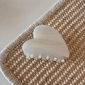 Detail view of a cream marble heart-shaped hair claw clip on a woven texture mat - White Glitter Jelly - Heart