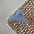 Detail view of a translucent blue jelly hair claw clip with a frosted matte finish - Glitter Jelly Blue - Triangle Shape