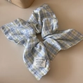 Detail of pink and blue plaid scrunchie with fabric label and decorative button - Blue Plaid - Square Style