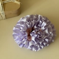 Detailed macro shot of purple ruffled carnation scrunchie with layered fabric pleats - Purple Pink