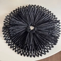 Detail of black laser-cut hollowed pleated scrunchie with intricate paper-cut style texture - Black