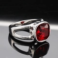 Macro shot of silver-tone stainless steel ring with a large square red gemstone and carvings - US 7 / Steel Color Red Gemstone
