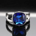 Detailed macro view of a vintage silver ring featuring a large cushion-cut blue gemstone - US 7 / Steel Color Blue Gemstone
