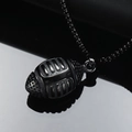 Detailed macro view of a vintage punk 3D rugby ball pendant in black stainless steel finish - Pendant Only (No Chain) / Black