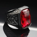 Macro shot of men's vintage titanium ring with large red rectangular gemstone and carvings - Size 7 / Black Base Red Gemstone