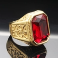 Close-up of vintage gold steel ring with large rectangular ruby gemstone and carvings - Size 7 / Gold Red