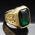 Macro shot of men's gold titanium ring with emerald-cut green gemstone and relief details - Size 7 / Gold Dark Green Stone