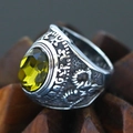 Macro shot of retro stainless steel ring with green gemstone and relief engraving - Size 7 / Relief Carved Flower Style (Steel Style 28) / Antique Silver (Olive Green Gemstone)