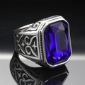 Macro shot of men's vintage steel ring with large blue gemstone and ornate side carvings - Size 7 / Vintage Silver Dark Blue Gemstone