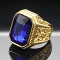 Detailed macro view of men's gold ring with a large rectangular blue sapphire gem - Size 7 / Gold Color Dark Blue Gemstone