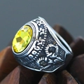 Macro detail of retro punk steel ring featuring large yellow gemstone and carved relief - Size 7 / Distressed Relief Style (Steel Style 21) / Antique Silver (Bright Yellow Gemstone)