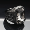 Macro detail of men's vintage black ring with large rectangular gemstone and gothic carving - Size 7 / Black Transparent Gemstone