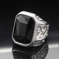 Macro shot of men's stainless steel ring featuring a large emerald-cut black gemstone - Size 7 / Steel Color Black Gemstone