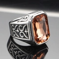 Detailed macro of vintage stainless steel ring with rectangular amber gemstone and carvings - Size 7 / Vintage Champagne Gemstone