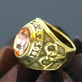Macro shot of vintage gold-tone ring featuring a large amber-colored oval gemstone - Size 7 / Amber Orange Rhinestone Palace Style (Gold Style 24) / Gold