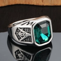 Detail of emerald cut green gemstone ring with Masonic symbols on silver steel band - Size 7 / Silver Green Gemstone