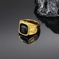 Detailed close-up of a golden Freemasonry ring featuring a square black gemstone - Gold Black