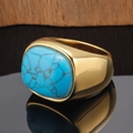 Detailed view of vintage gold ring featuring a large rectangular turquoise stone with web texture - Gold Turquoise