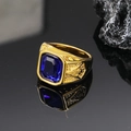 Macro view of gold signet ring with blue gemstone and Freemasonry side engraving - Gold Blue