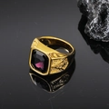Detailed macro view of gold Masonic ring with large purple gemstone and side carvings - Gold Purple Gemstone