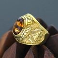 Macro shot of gold-plated masonic ring featuring a faceted amber gem and proud engraving - Size 7 / All-Seeing Eye Relief Style (Gold Style 13) / Gold (Amber Gemstone)