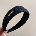 Detail of black knitted headband with woven TRUE FITTED letter patch for winter - Letter Patch Knitted Headband - Black