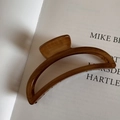 Detail of a large semi-circle hair claw clip with vintage brown wood grain texture - Hanger Shape / Light Wood Grain