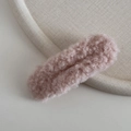 Detailed view of the soft rose pink plush lamb velvet hair clip with fuzzy texture - Pink