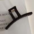 Macro shot of large square leopard print hair claw clip with golden metal spring detail - Shimmer Brown Leopard Thin Bar