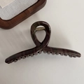 Macro shot of large dark green plaid hair claw clip with glossy finish and metal spring - Dark Red Green Plaid Hanger Style