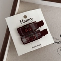 Close-up of sweet cherry hair clips with dark red plaid fabric on white display card - Rectangle