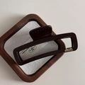 Macro view of dark brown large hair claw clip with gold Barrette La France lettering - Chocolate-Rectangle