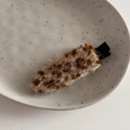 Detail of plush leopard print hair clip with soft faux fur texture and black matte base - Sparkly Leopard Light Coffee