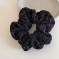 Detailed close-up of dark grey plush wool hair scrunchie with soft fluffy texture - Black Fluffy Fabric Scrunchie