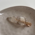 Detailed macro of marble texture acetate hair clip with rose gold metal fastener - Textured Acetate Clip-Mermaid Gray