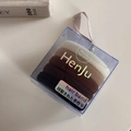 Close-up of five seamless high-elastic hair ties in gradient earthy tones within a clear box - Plain Black Coffee