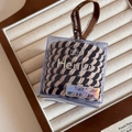 Detail of striped hair ties in a transparent square gift box with a brown satin ribbon - Twill Beige Black