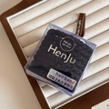 Macro shot of high-elastic black woven hair ties in a premium transparent square gift box - Woven Black