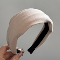 Detail showing high-thickness light beige padded headband with soft knitted texture - Apricot