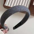 Detail showing grey fuzzy wool blend headband with a HANDMADE label on interior - Gray