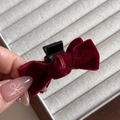 Detail of a burgundy velvet bow hair claw clip showing soft texture and grip - Burgundy