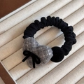 Detailed view of black elastic hair scrunchie with grey plush heart and velvet bow detail - Gray Flocked Bow Heart Hair Tie