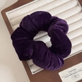 Detailed close-up of dark purple velvet scrunchie showing soft texture and pleated design - Charming Purple Velvet Scrunchie