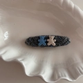 Detail of cute bear fabric hair clips on a white shell plate with a soft knit texture - Blue Gray Bear-Long Oval