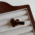 Detailed macro view of heart-shaped leopard print hair clip with France Handmade lettering - Dark Heart / Duckbill Hair Clips