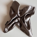 Detail showing high-quality silver satin fabric texture with a black woven label tag - Square Scrunchie / Brown