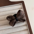 Close-up of brown tweed bow hair clip with textured wool fabric and black ribbon - Coffee Bow Claw Clip
