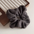 Detailed view of dark grey herringbone wool hair scrunchie with soft fabric texture - Patterned Wool Ring (FQ881325) / Brown