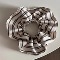 Detailed close-up of striped silk-like scrunchie fabric with elegant pearl pendant detail - Cream Striped Ruffle Scrunchie